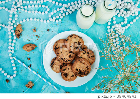 Cookie chocolate with a milk bottles.  39464843