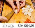 Female person slicing garlic for cooking 39466489