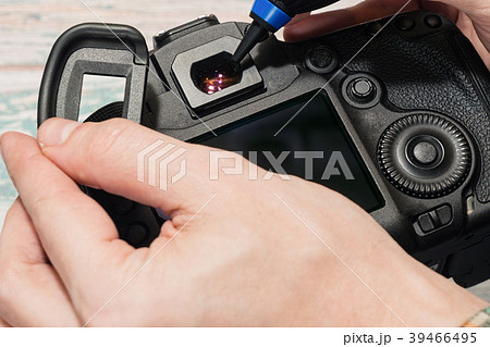 Digital camera dust cleaning service concept 39466495