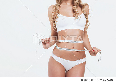 Young beautiful girl measures your body parts of 39467586