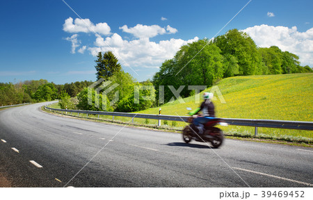 Motobike on asphalt road in beautiful summer Motobike on asphalt road in beautiful summer 39469452
