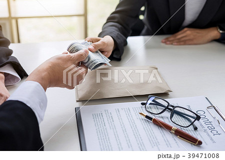 Bribery and corruption concept, bribe in the form of dollar bill 39471008