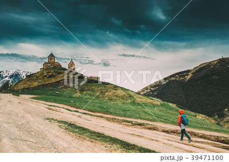 Stepantsminda, Gergeti, Georgia. Woman Walking Stepantsminda, Gergeti, Georgia. Woman Walking 39471100