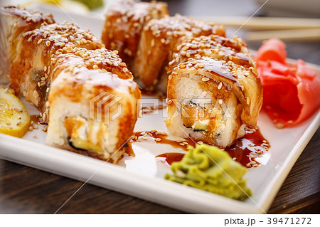 Sushi rolls, nigiri, maki, pickled ginger, wasabi. 39471272