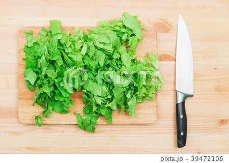Close-up on a wooden table is a wooden cutting 39472106