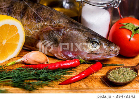 Fresh zander wilt lemon, pepper and spices close Fresh zander wilt lemon, pepper and spices close 39473342