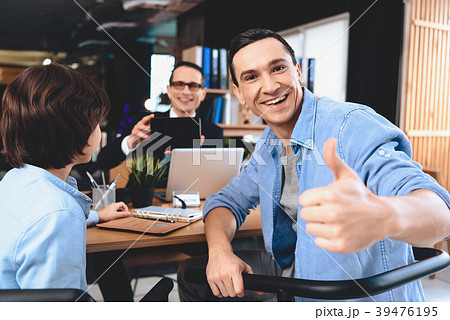 Realtor sitting at desk in office. Realtor sitting at desk in office. 39476195