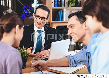 Realtor sitting at desk in office. Realtor sitting at desk in office. 39476210