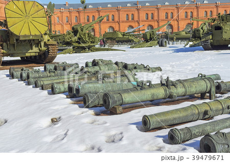 trunks of old guns lie on the snow in courtyard trunks of old guns lie on the snow in courtyard 39479671