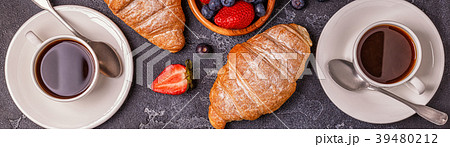 Breakfast with fresh croissants and coffee. Breakfast with fresh croissants and coffee. 39480212