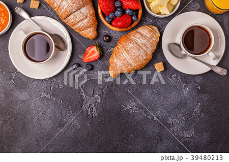 Breakfast with fresh croissants and coffee. Breakfast with fresh croissants and coffee. 39480213