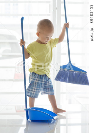 Toddler sweeping floor Toddler sweeping floor 39483455