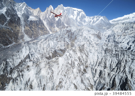 Ultralight plane flies over Pokhara, Machapuchare Ultralight plane flies over Pokhara, Machapuchare 39484555