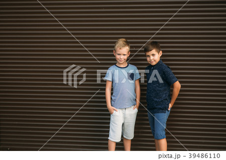 Two children are playing in the park. Two 39486110