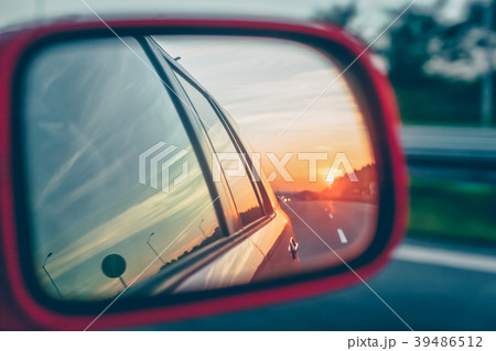Sunset reflection in the rear view mirror Sunset reflection in the rear view mirror 39486512