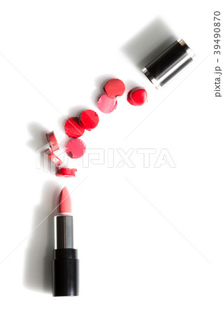 red sliced pieces between lipstick and cap 39490870