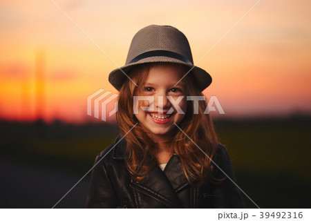 beautiful girl with hat on evening sunset 39492316