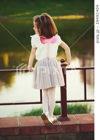 little girl with pink wings little girl with pink wings 39492404