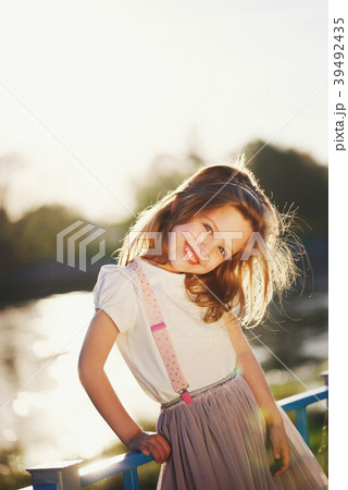 cute little girl in summer park cute little girl in summer park 39492435