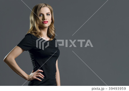 Elegant young business woman blond in black dress 39493959