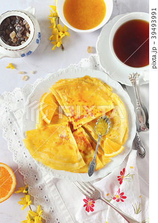 Thin pancakes (blinis) in orange sauce  39493991