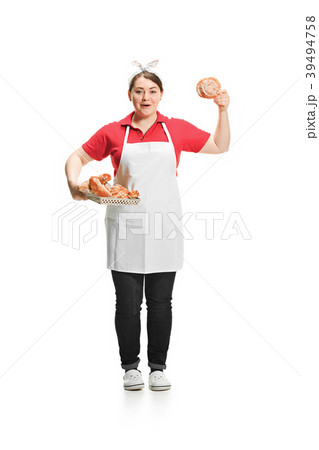 Portrait of cute smiling woman with pastries in 39494758