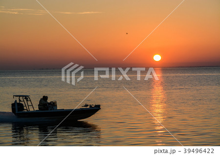 Sunrise with silhoette of boat, Tampa Bay, Florida Sunrise with silhoette of boat, Tampa Bay, Florida 39496422