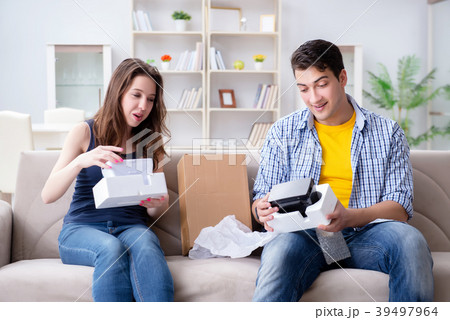 Young family playing games with virtual reality 39497964