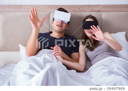 Wife and husband with virtual reality goggles in Wife and husband with virtual reality goggles in 39497989