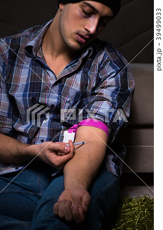 Young man in agony having problems with narcotics Young man in agony having problems with narcotics 39499033