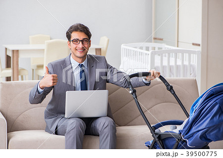 Businessman looking after newborn baby at home and 39500775