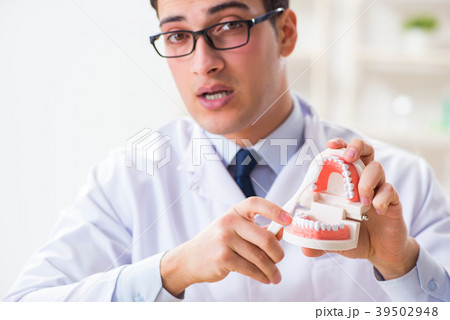 Young dentist working in the dentistry hospital 39502948