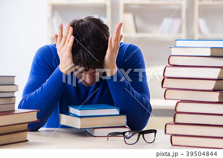 Male student preparing for exams in college 39504844