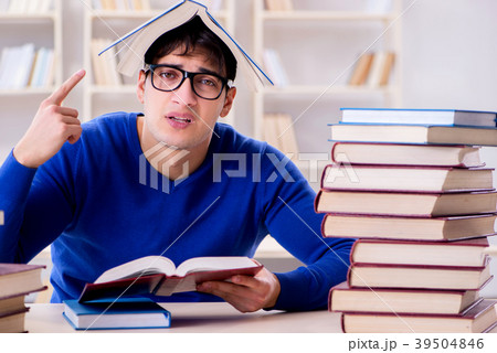 Male student preparing for exams in college 39504846
