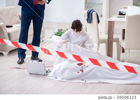 Forensics investigator at the scene of office 39506123