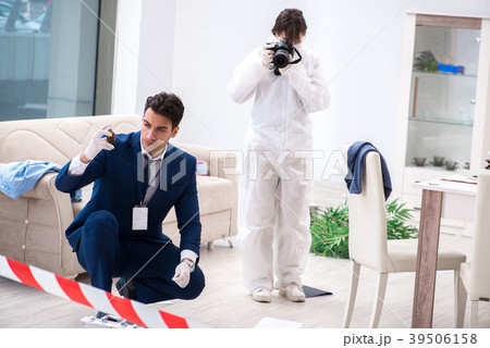 Forensics investigator at the scene of office Forensics investigator at the scene of office 39506158