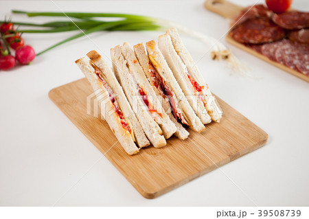 Top view of four club sandwiches on wooden board 39508739