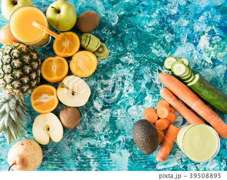 Glasses with detox juice next to fruits and Glasses with detox juice next to fruits and 39508895
