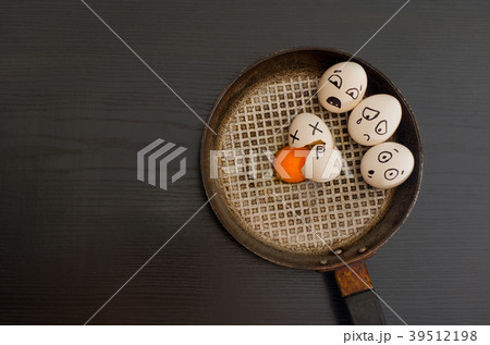 Eggs with the drawn emotions, broken egg 39512198