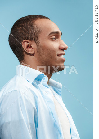 The happy businessman standing and smiling against The happy businessman standing and smiling against 39515715
