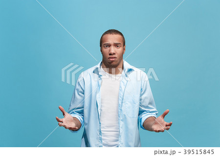 Afro man looking suprised and bewildered isolated Afro man looking suprised and bewildered isolated 39515845