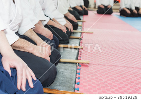 People in kimono on martial arts weapon training People in kimono on martial arts weapon training 39519329