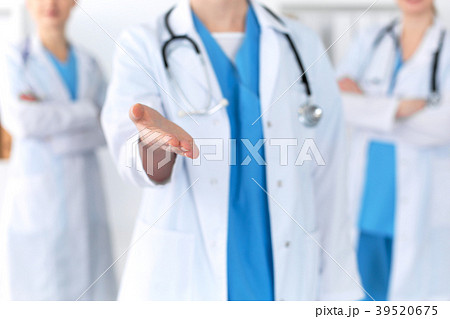 Group of medicine doctors offering helping hand Group of medicine doctors offering helping hand 39520675