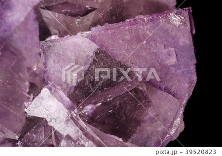 Surface of a fluorite crystal cluster over black Surface of a fluorite crystal cluster over black 39520823