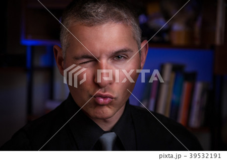 elegant man winks elegant man winks 39532191