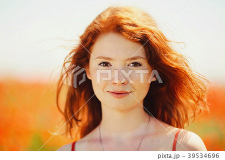 beautiful girl in poppy field 39534696