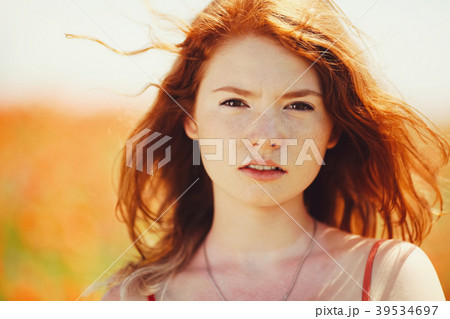 beautiful girl in poppy field 39534697