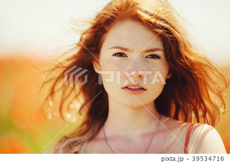 beautiful girl in poppy field 39534716