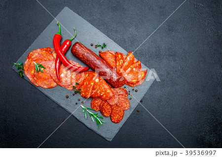 Dried organic salami sausage on wooden cutting 39536997