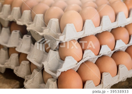 raw chicken eggs in egg box on the table wooden. raw chicken eggs in egg box on the table wooden. 39538933